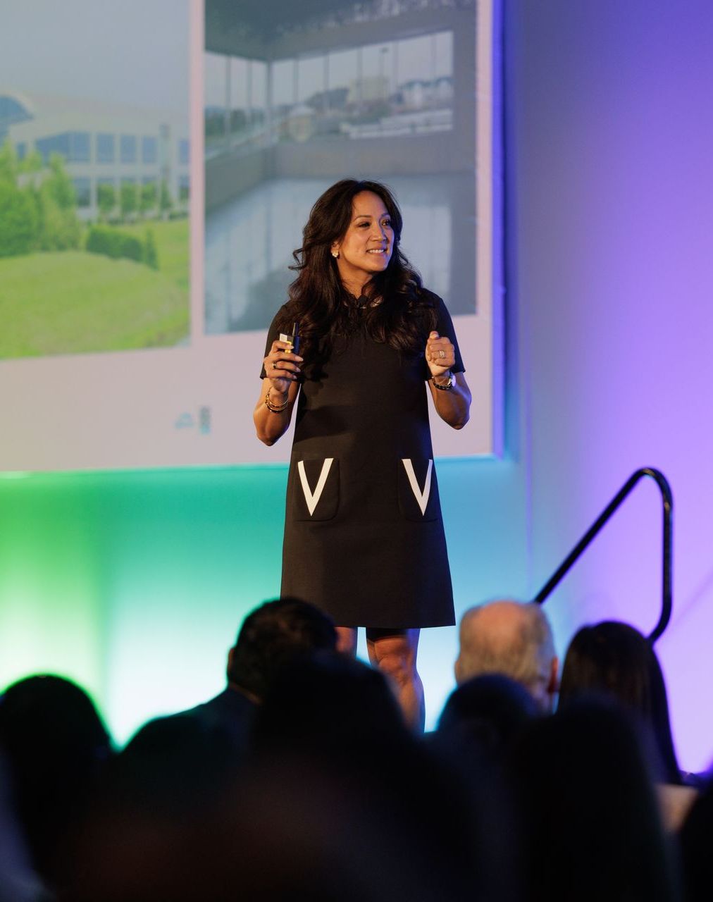 Dr. Valerie Woo speaking at a conference
