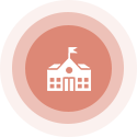White school building with flag within salmon-colored circles.