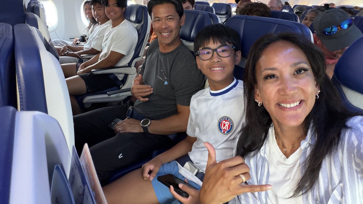 Dr. Valerie Woo's family on the plane, heading home to the Philippines
